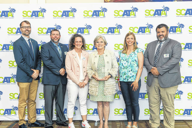 From left, Jeremy R. Searson, PhD, SCAT, ATC, Joe Cauble, MA, SCAT, ATC, Amy Fraley-Hand, PhD, SCAT, ATC, CSCS, TSAC-F, Senator Shealy, Abby DeDecker, MHRD, SCAT, ATC, Will Christman, MS, SCAT, ATC.
Photo by Bonnie Smith