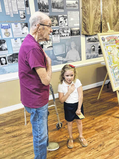 Korean War veteran James Whitley, who is 91-years-old, and his great-granddaughter Sophie Hamrick led the audience in the Pledge of Allegiance.
                                 Courtesy photos