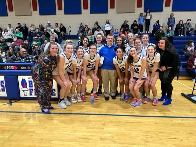Gary Monroe is pictured on Friday night after the Pickens girls basketball team defeated Easley 38-26. Monroe was honored with a plaque for his 40 years as an assistant coach for Pickens High School.
Courtesy photo