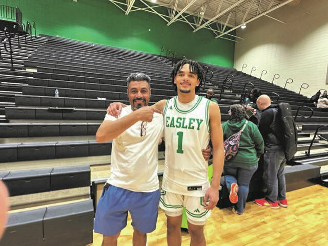 Easley High School senior Will Patton (No. 1) and his dad, Henry, last Friday night after the Green Wave defeated rival Pickens.
Courtesy photo