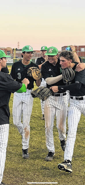 EHS senior left fielder Braxton Patton (right) gunned down a runner at home plate last week and is congratulated by Brayden Bryson and Ayden Beeco.
Jeff Holt | The Easley Progress