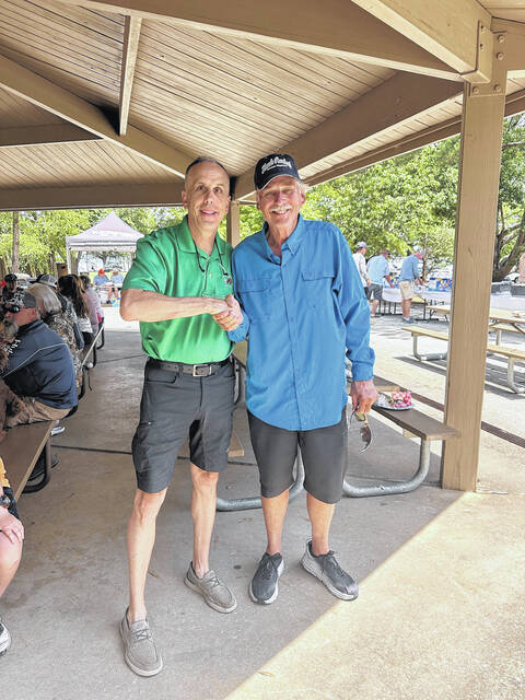 The Easley Progress Sports Editor Jeff Holt is pictured with fishing icon Hank Parker on Saturday afternoon at Lake Hartwell at The Dream Foundation fishing outing for the kids. A meal and an awards ceremony followed.
                                 Photo Submitted