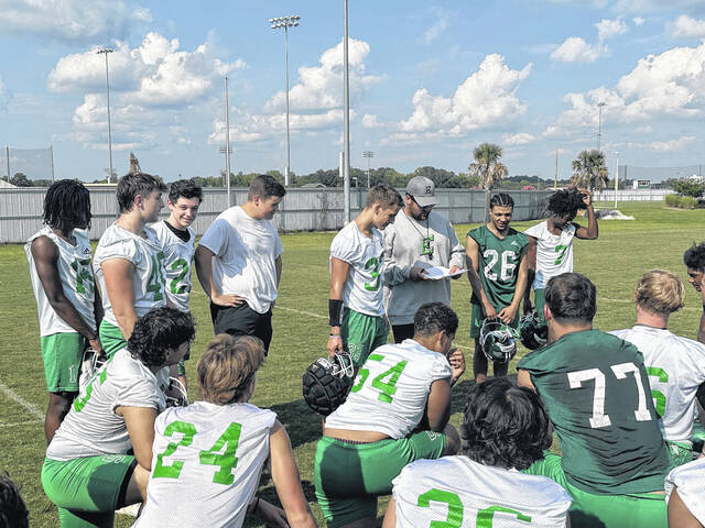 Easley varsity football coach Sam Houston reads the names of his players who were pointed out for doing a top-notch job in chemistry class at EHS. The Green Wave open up the season on Friday night at Pickens.
Jeff Holt | The Easley Progress