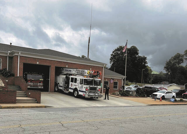 Housed in the countys old jail building, The Pickens County Museum of Art & History got a bit noisy when the Daughters of the American Revolution (DAR) started ringing their bells, then the Pickens Fire Dept. joined in with a few blasts from their fire engines.
                                 Lynda Abegg | The Easley Progress
