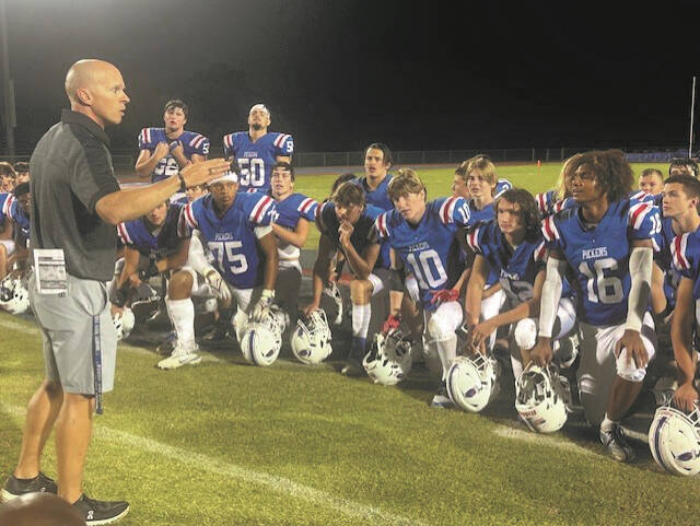 Pickens coach James Reynolds has a sideline talk with his players.
Courtesy photo