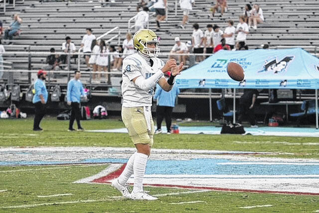 Daniel High School sophomore quarterback Grayson Clary warms up before a recent varsity game. Clary and the Lions are off to a 10-1 start this season and enter the second round of playoffs.
Photo Submitted