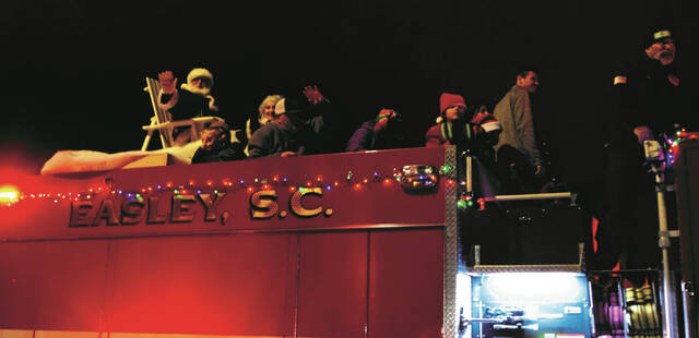 Santa closes out the parade from atop a fire truck.
                                 Kasie Strickland | The Easley Progress