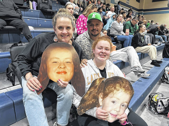 Pictured is Easley High School senior Abbi Vite with her parents after her final basketball game at Easley High School. Vite is planning to return next year as an assistant coach at EHS.
                                 Jeff Holt | The Easley Progress