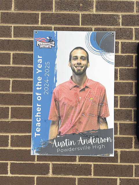 Pictured is the poster of Austin Anderson as the Teacher of the Year as you walk in the front door of Powdersville High School. Anderson is beginning a new journey in life next year at Easley High School in teaching and as the varsity boys basketball coach for the Green Wave.