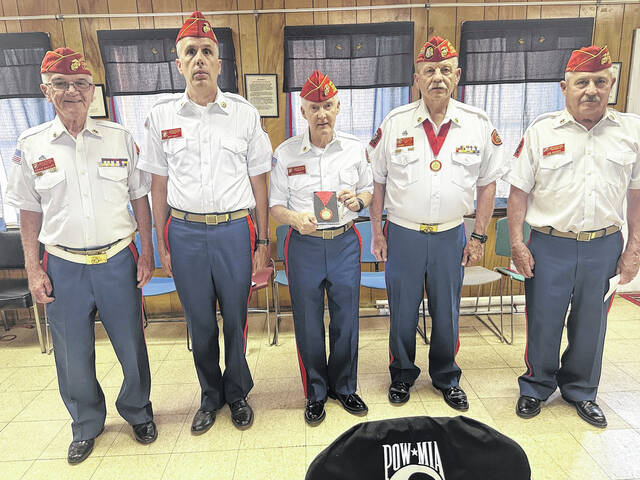 Mike Merrill (center) received the Marine of the Year award recently at the monthly meeting of the local Marine Corps League.
Photo Submitted