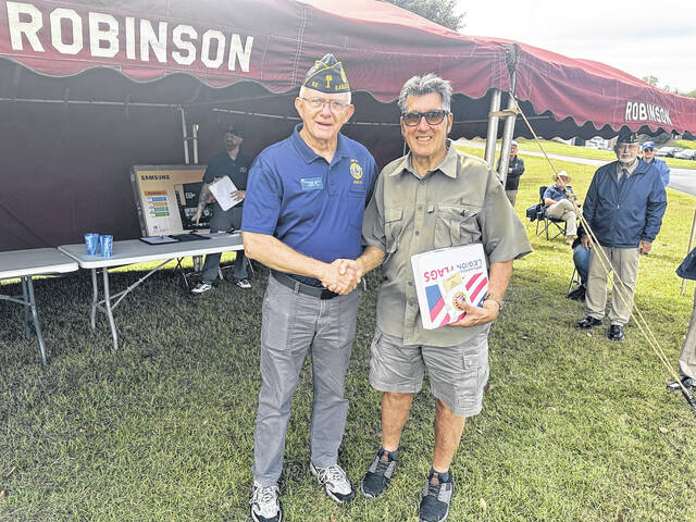 Richard Mintz of Post 52 helped honor all the winners of the specialty cars on Saturday for the Car, Truck and Bike Show on Saturday in Powdersville. The event was put on by Robinson Funeral Home and members of Post 52 helped with the judging of the best vehicles.
                                 Jeff Holt | The Easley Progress