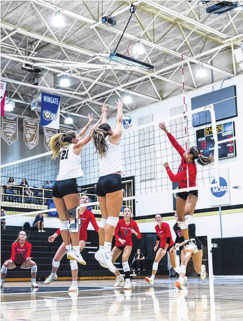 Powdersville standout Maura Kindel (No. 21) goes up for a big block recently for the Anderson University volleyball team.
                                 Photo Courtesy of Parker Bryant