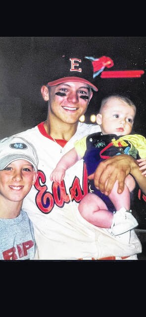 Pictured is the late Justin Bray in his Easley American Legion uniform with his nephews Tyler Baumgarner (left) and Reagan Baumgarner (right).
                                 Photo Submitted