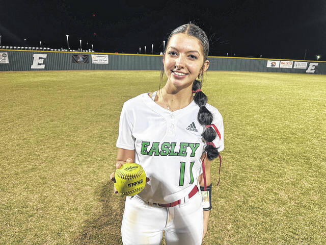 Easley High School senior Abby Wade holds the game ball after throwing a 1-hitter last week in a 16-0 win over over Pickens in five innings. Wade turned in the memorable performance for her dad who passed away three years ago to the day.
Jeff Holt / The Easley Progress