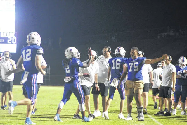 Pickens senior runningback David Bolden (No. 2) celebrates after scoring a couple touchdowns with senior TJ McCullough (No. 75) last Friday night.
Jeff Holt / The Easley Progress